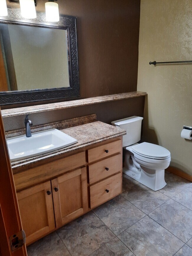 lower level half bath with laundry hook ups - 2978 Sunshine Pl