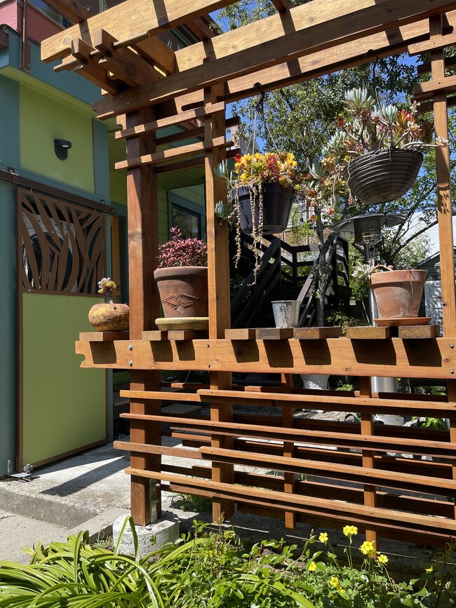 Architect-designed artful trellis for plants and aesthetic. - 3918 Webster St