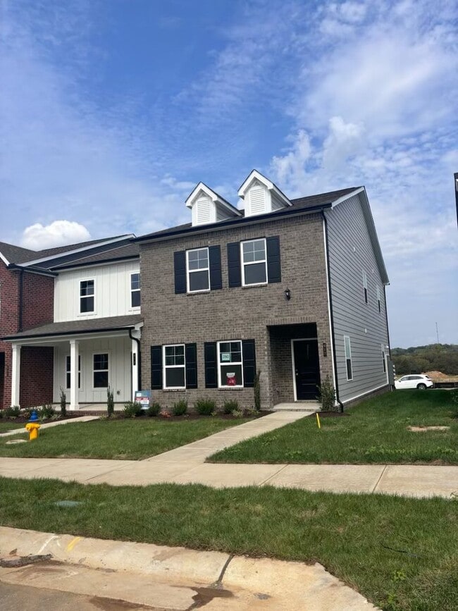 Building Photo - **BE THE LUCKY ONE TO LIVE IN THIS 2024-BUILT END-UNIT TOWNHOME IN A RESORT-STYLE COMMUNITY**
