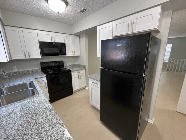 Building Photo - 1/2 OFF 1ST MONTH RENT! Modern 3-Bed, 2.5-Bath Townhome with Granite Kitchen & New Appliances!