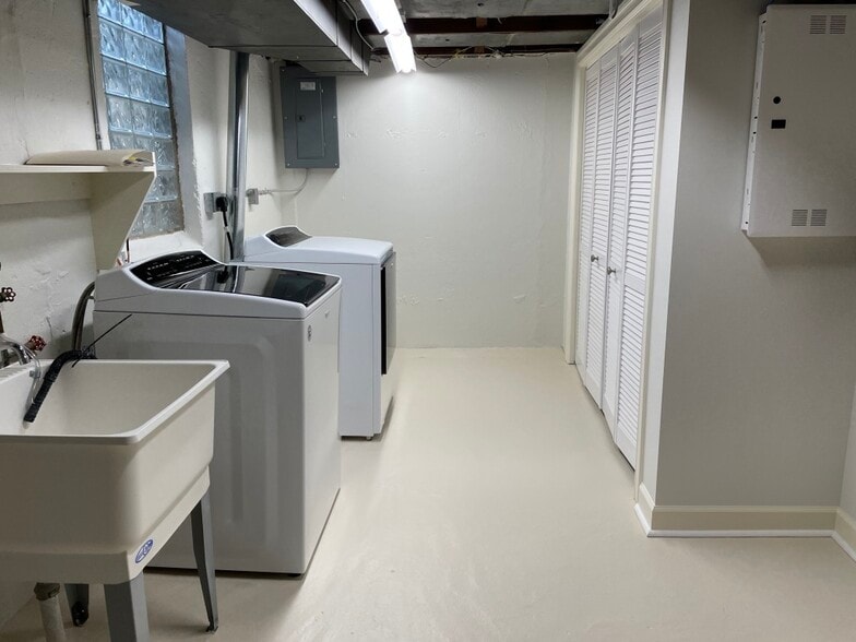 Utility room with newer washer and dryer and spacious closet. - 1620 Graefield Rd