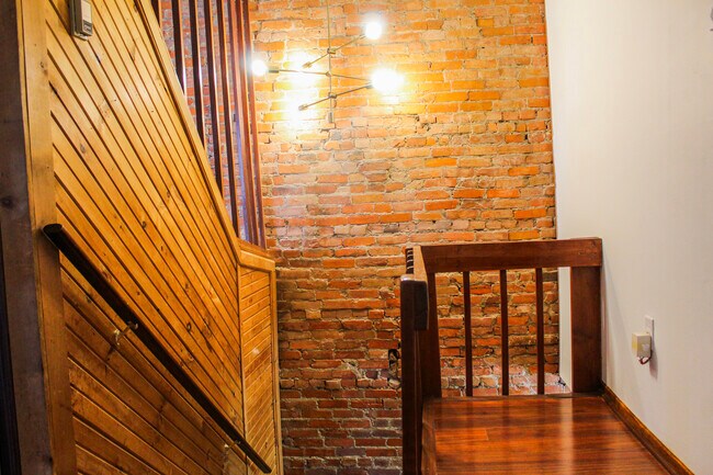 Exposed Brick Leading to First Floor - 505 N Rodney St