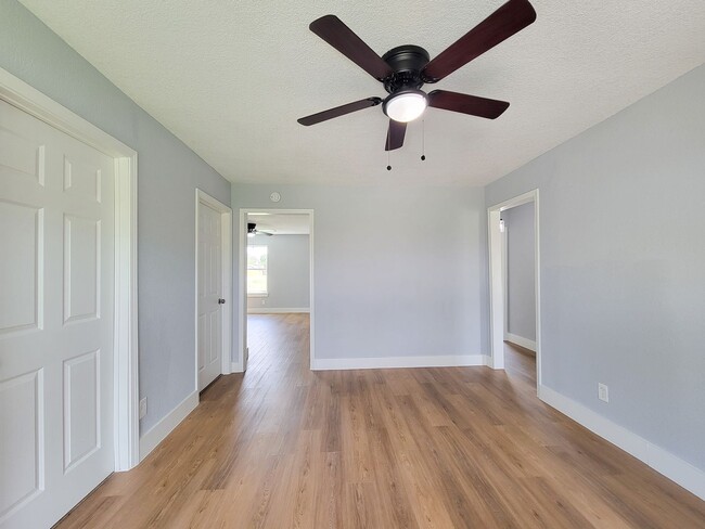 Building Photo - This beautifully updated 4-bedroom home is just under two miles from Highway 288 and Loop 610, ma...