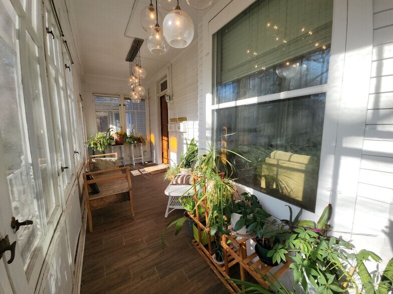 4-season front porch is communal space and gets great golden hour light! - 3747 N Kostner Ave