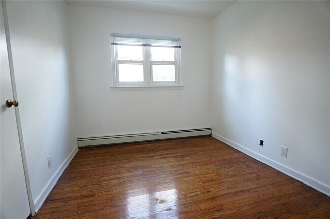 Building Photo - 203-12 42nd Ave