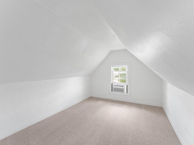 Building Photo - Renovated 3-Bedroom Apartment with Bonus Finished Attic & Spacious Shared Backyard