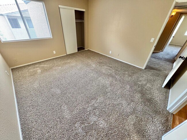 Building Photo - THIS SECOND-FLOOR DESERT SHORES CONDO OFFE...