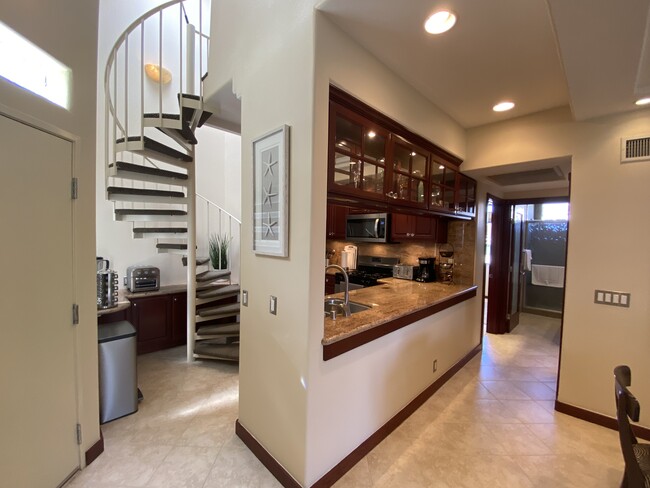 Hallway leading to bedrooms/bathrooms and spiral staircase leading to loft - 5146 Dorado Dr