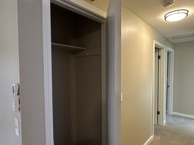 Building Photo - Spacious & Stylish 3BD Home with Iconic Stone Fireplace + Soaking Tub