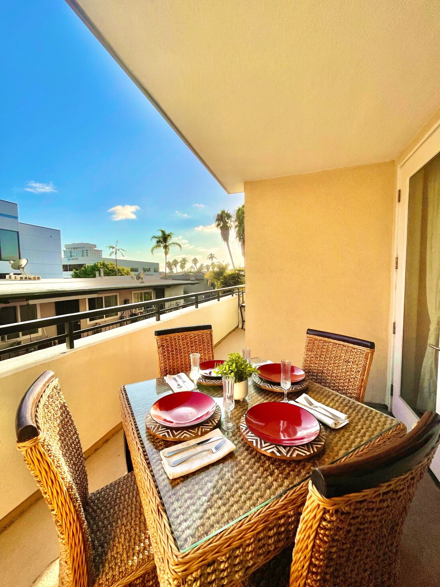 Private balcony with outdoor dining set — ideal for relaxing or meals. - 3687 4th Ave