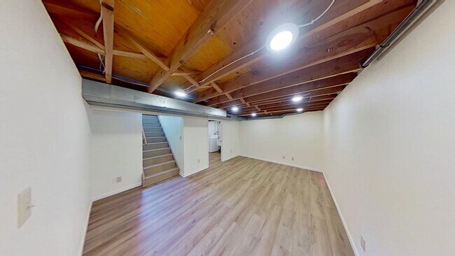 Building Photo - Updated two bedroom duplex, new stainless steel appliances, garage, and hardwood floors