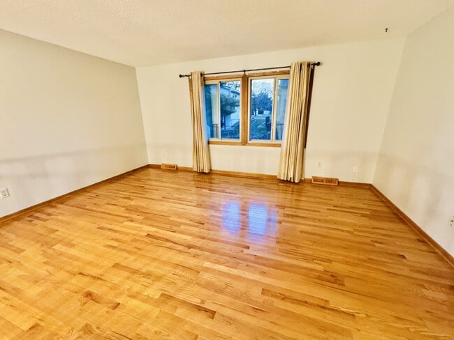 Building Photo - "Charming 4-Bedroom Home with Granite Elegance & Hardwood Warmth in Savage!"