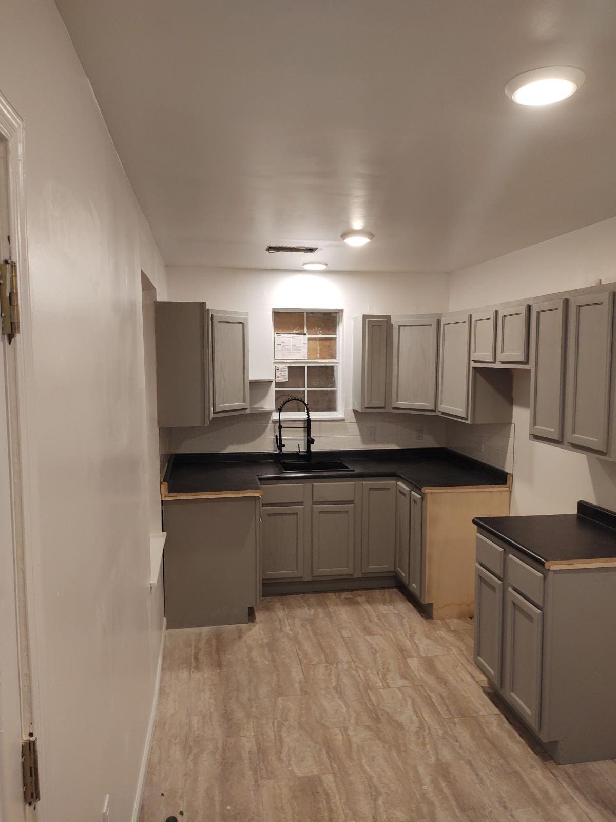 Updated kitchen with new fixtures and cabinets - 1819 Wells Station Rd