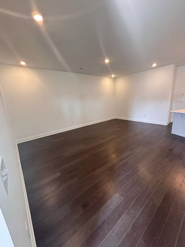 Building Photo - **BE THE LUCKY ONE TO LIVE IN THIS 2024-BUILT END-UNIT TOWNHOME IN A RESORT-STYLE COMMUNITY**