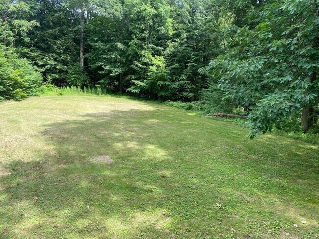 Building Photo - Secluded 4 bedrooms 3 baths with 2 car garage and fenced in yard in the town of Rutland for rent!