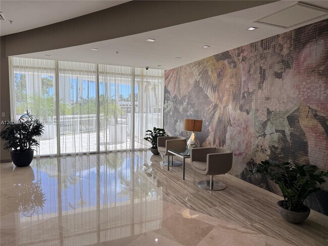 Building Photo - 10275 Collins Ave