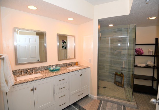 Updated master bathroom that is right out of - 5799 NE Island Cove Way