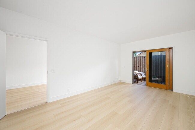 Downstairs bedrooms can be open to one another or closed off for privacy. - 518 Euclid St