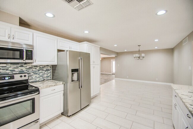 Building Photo - Beautifully remodeled corner 4/2 with pool...