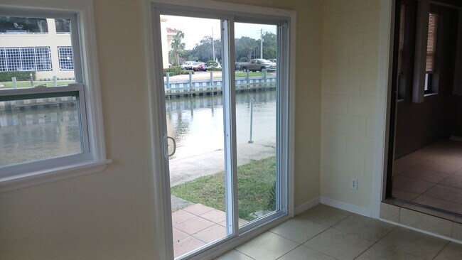 Sunroom Canal view - 211 Sandy Cir