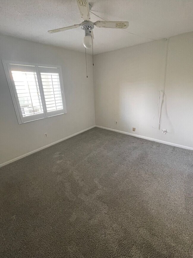 Building Photo - 55+ Charming first-floor condo nestled in the serene Fairways 3 Condominiums