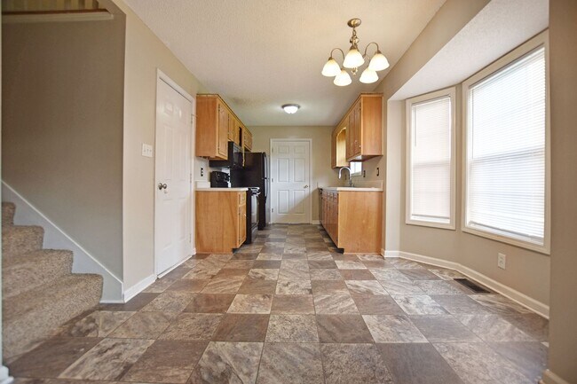 Building Photo - Pet Friendly Three Bedroom with Bonus!