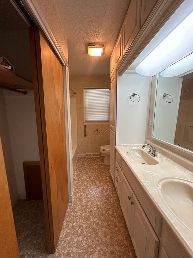 Building Photo - Spacious brick house with a caport and unf...