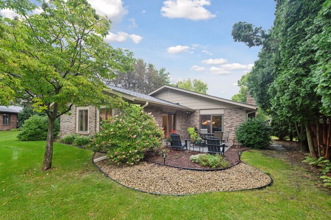 A view of the backyard and pretty landscaping - 245 Inland Ln N