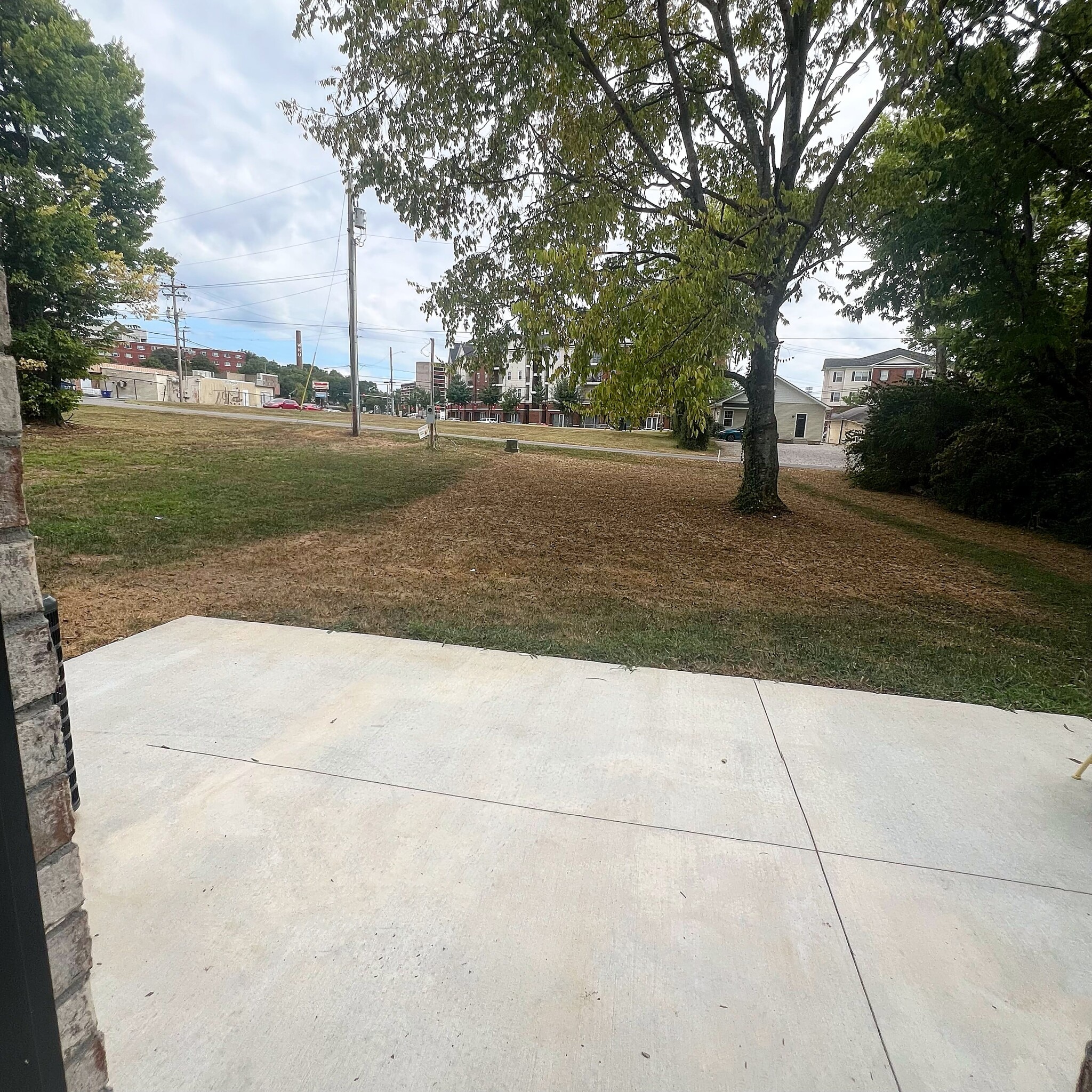 Spacious backyard with a poured concrete patio—your own outdoor retreat - 205 Cherry Way