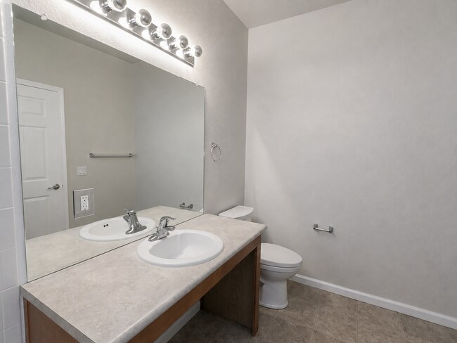 Building Photo - Spacious 2-Bedroom Condo with Garage, Fireplace, Pool & Most Included Utilities