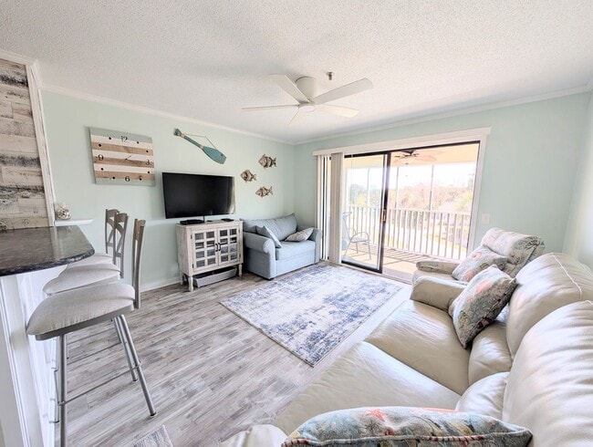 Building Photo - Dreamy Little River Condo — Furnished, Elevator Access, Pool & Marina Nearby!