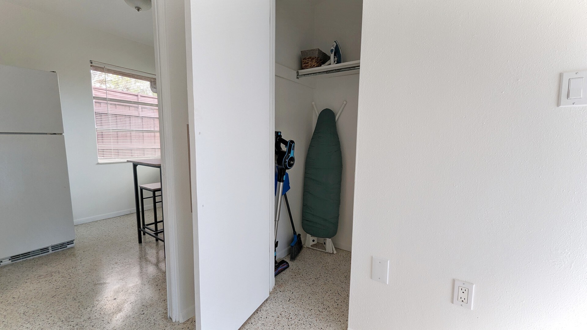 Additional storage with amenties include vacuum, iron and ironing board - 2846 W Tamiami Cir