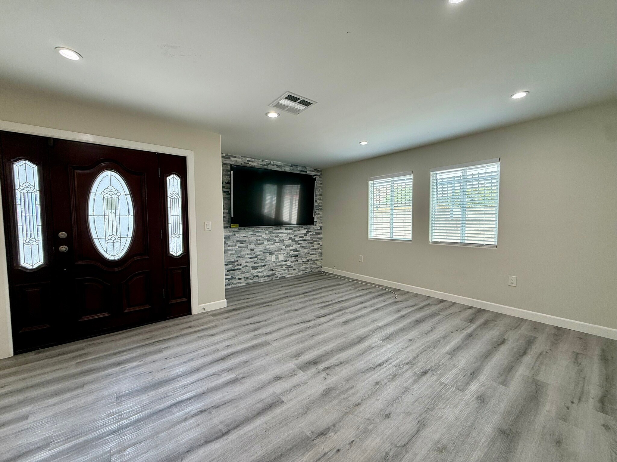 Living room with brand new TV - 1141 W 49th St