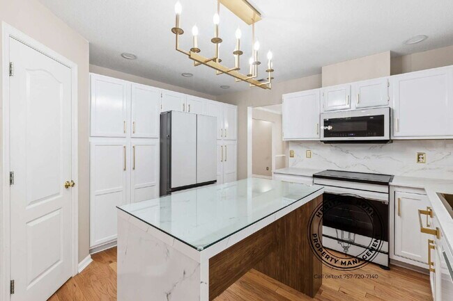 Building Photo - "Charming 4-Bedroom Retreat with Fireplace & Hardwood Floors on Michelle Drive!"