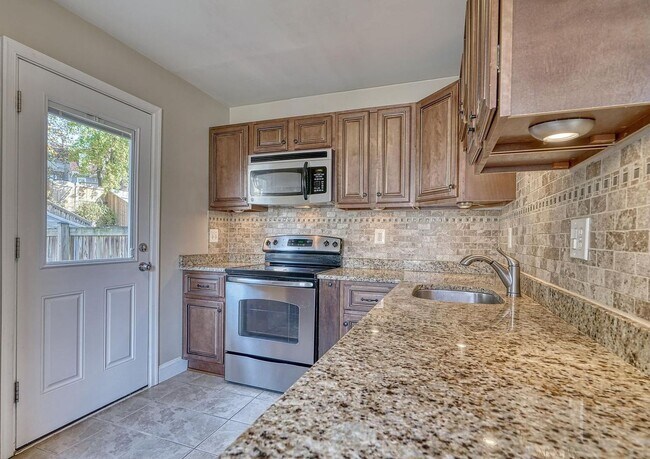 Building Photo - Updated End-of-Group Townhome with Finished Lower Level, Fenced Yard & Community Pool