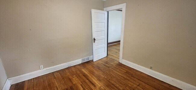 Building Photo - Fully fenced yard with stainless steel appliances including gas stove!