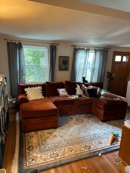 Spacious living room, front entrance and stairs to upstairs bed and bath. - 189 Newman St