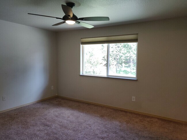 Building Photo - Charming 4-Bedroom Home on 1/2 Acre with a Fenced Backyard, Fully Insulated Double-Car Garage, in...