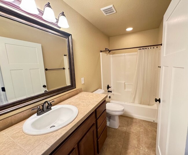 Building Photo - 4 BEDROOM, 3 BATHROOM TWINHOME WITH 2 CAR ATTACHED GARAGE IN NORTH CHEYENNE