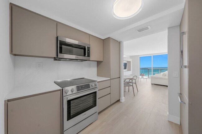 Building Photo - 6365 Collins Ave