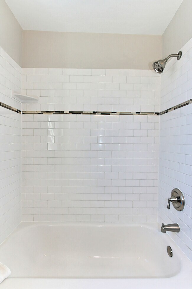 Modern white subway tile in bath/shower - 2873 S Buchanan St