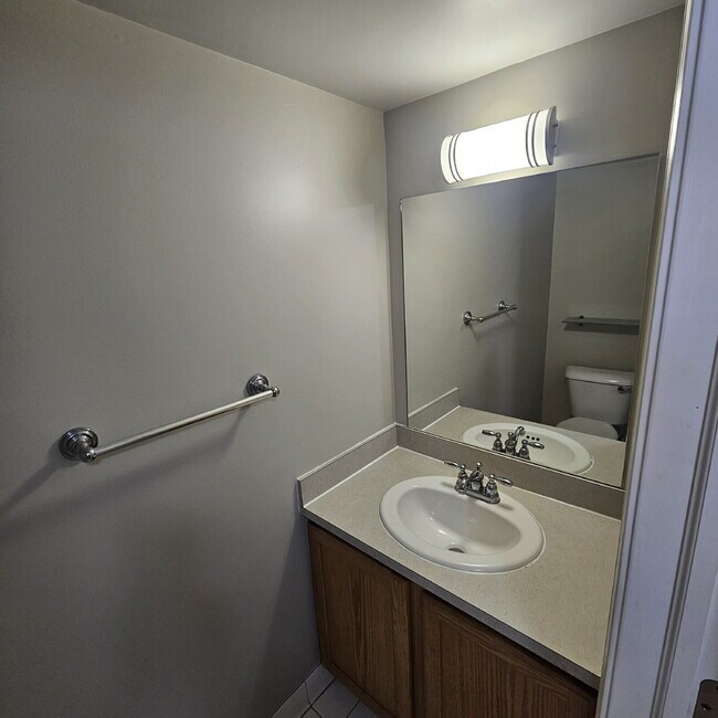 Building Photo - 2 Bedroom, 1.5 Bath Townhouse w/ Garage & Huge Master Bedroom. Full Sized Washer & Dryer In Unit.