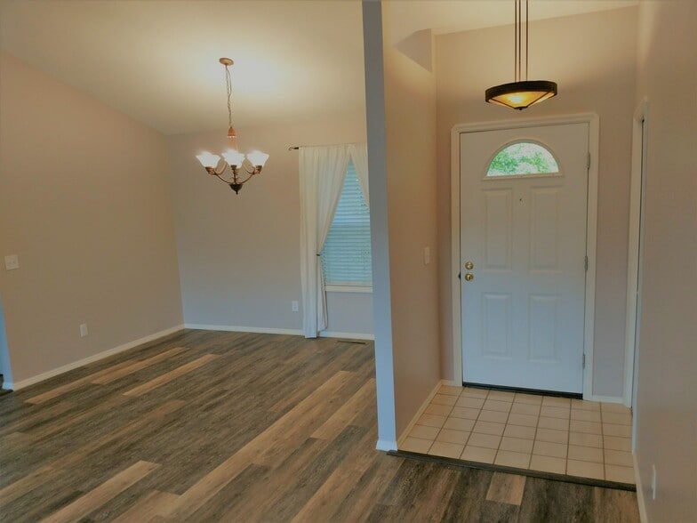 Inside front door, and dining area off of the kitchen. - 310 N Sweetgrass Ave