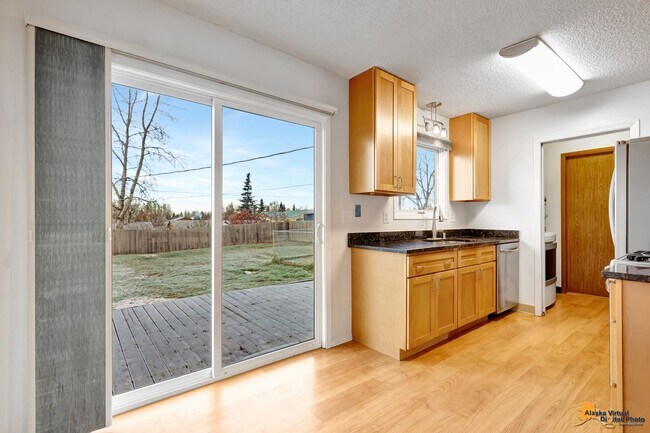 Building Photo - Cozy Abbott Loop Single Family Home w/ Garage & Fenced in Yard