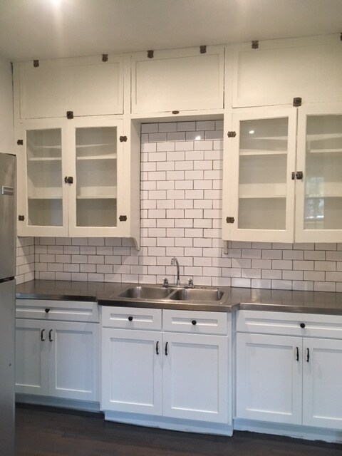 Kitchen with original glass front upper cabinets - 1131 W Lynwood Ave