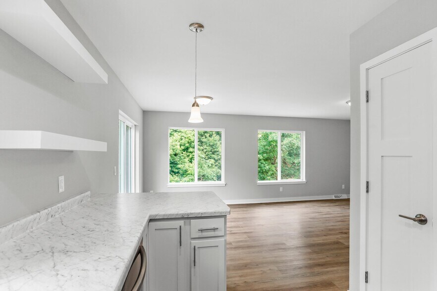Kitchen into dining - 200 Chalet Dr