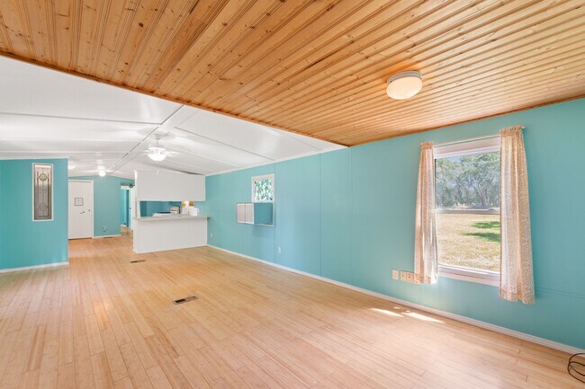 Building Photo - Updated mobile home on acre lot with garag...