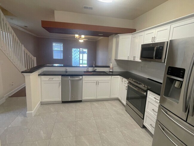 Building Photo - Stunning townhome in gated community near ...