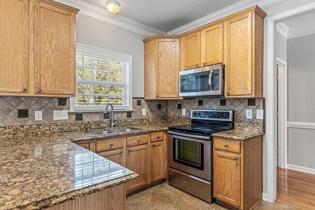 Building Photo - W. Wendover, Beautiful Home, Granite Counter-Tops, SS Appliances, Hardwoods, FP, Deck, Fenced, Ga...