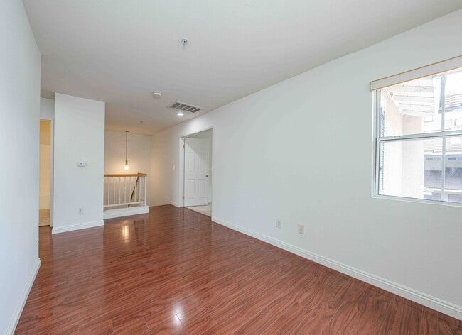 Building Photo - Gated Townhome with Updated Kitchen and Private Backyard